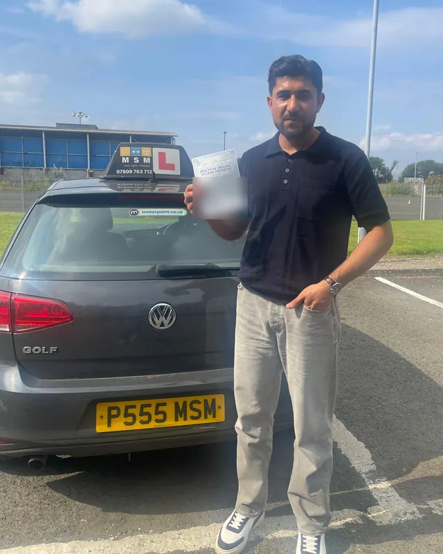 Sami beside the MSM car after passing at Shieldhall